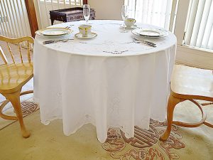 90" round embroidered tablecloth.