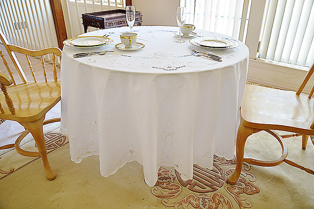 90" round embroidered tablecloth.